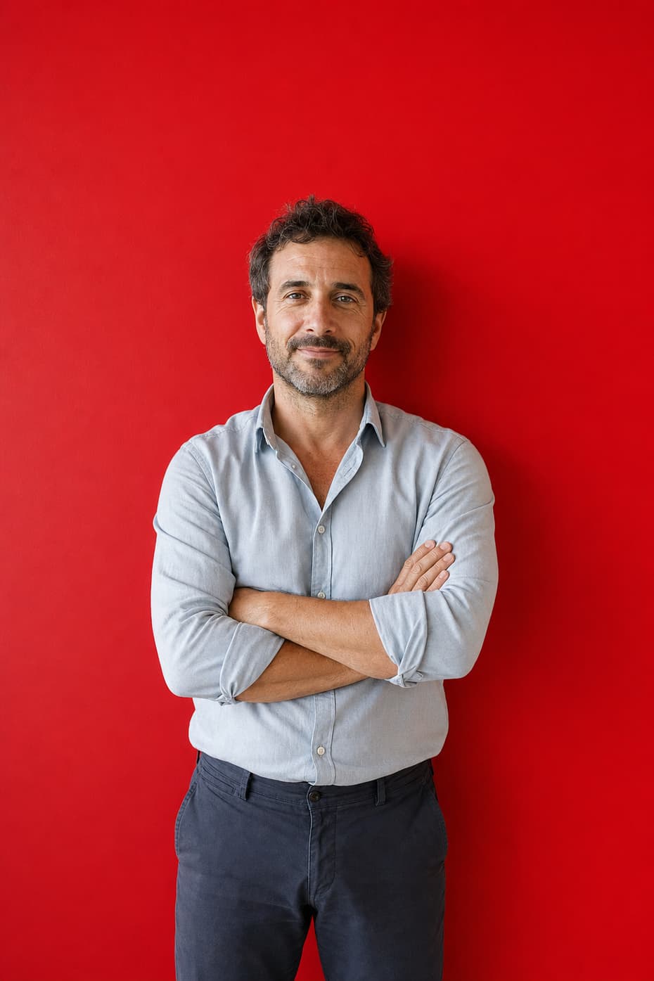 An experienced travel advisor with arms folded
